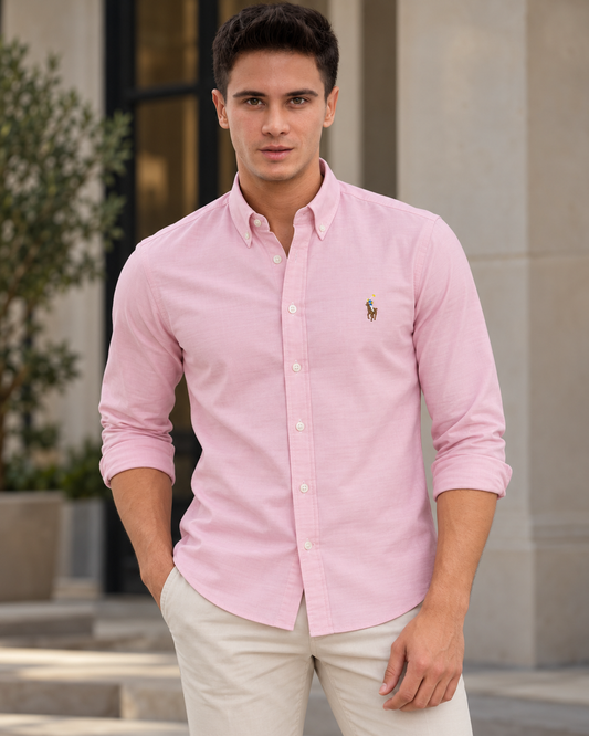 Model wearing the pink slim fit Oxford button-down shirt, lifestyle view
