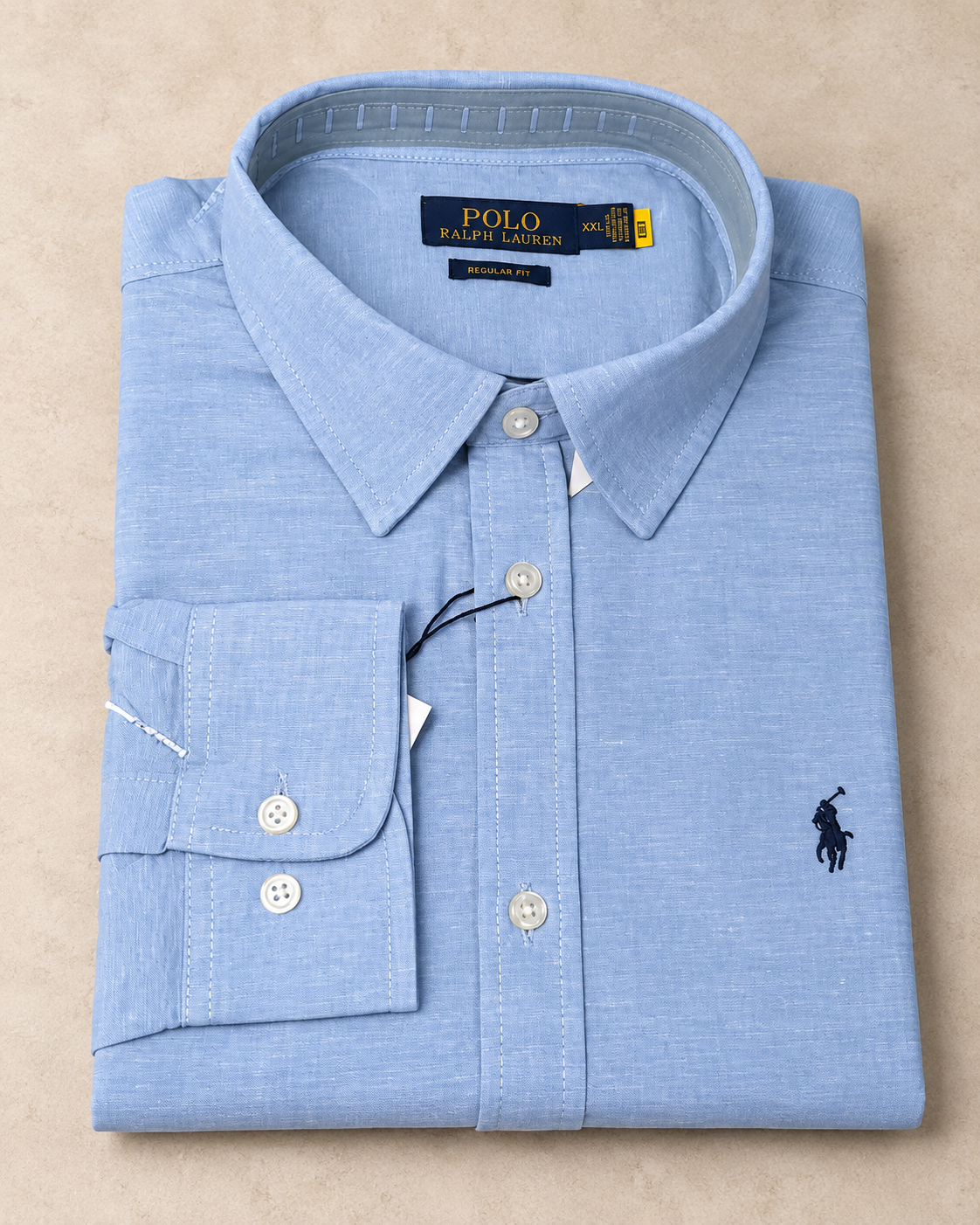 Baby blue long-sleeve shirt folded, flat lay