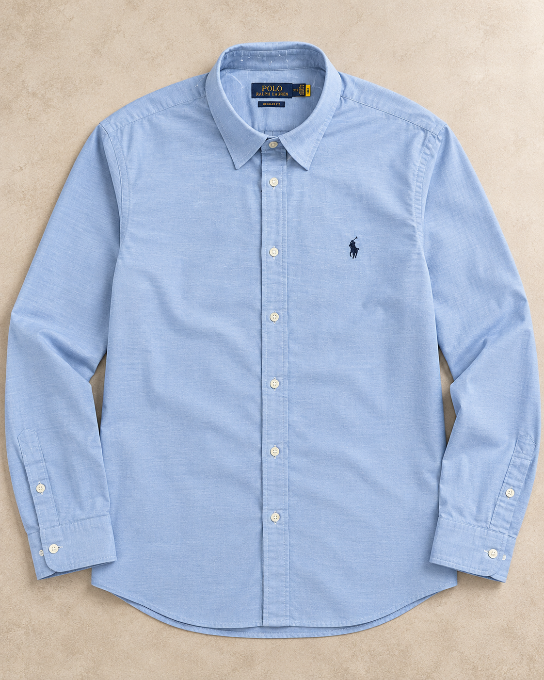 Baby blue long-sleeve button-up shirt with navy pony logo, full flat lay