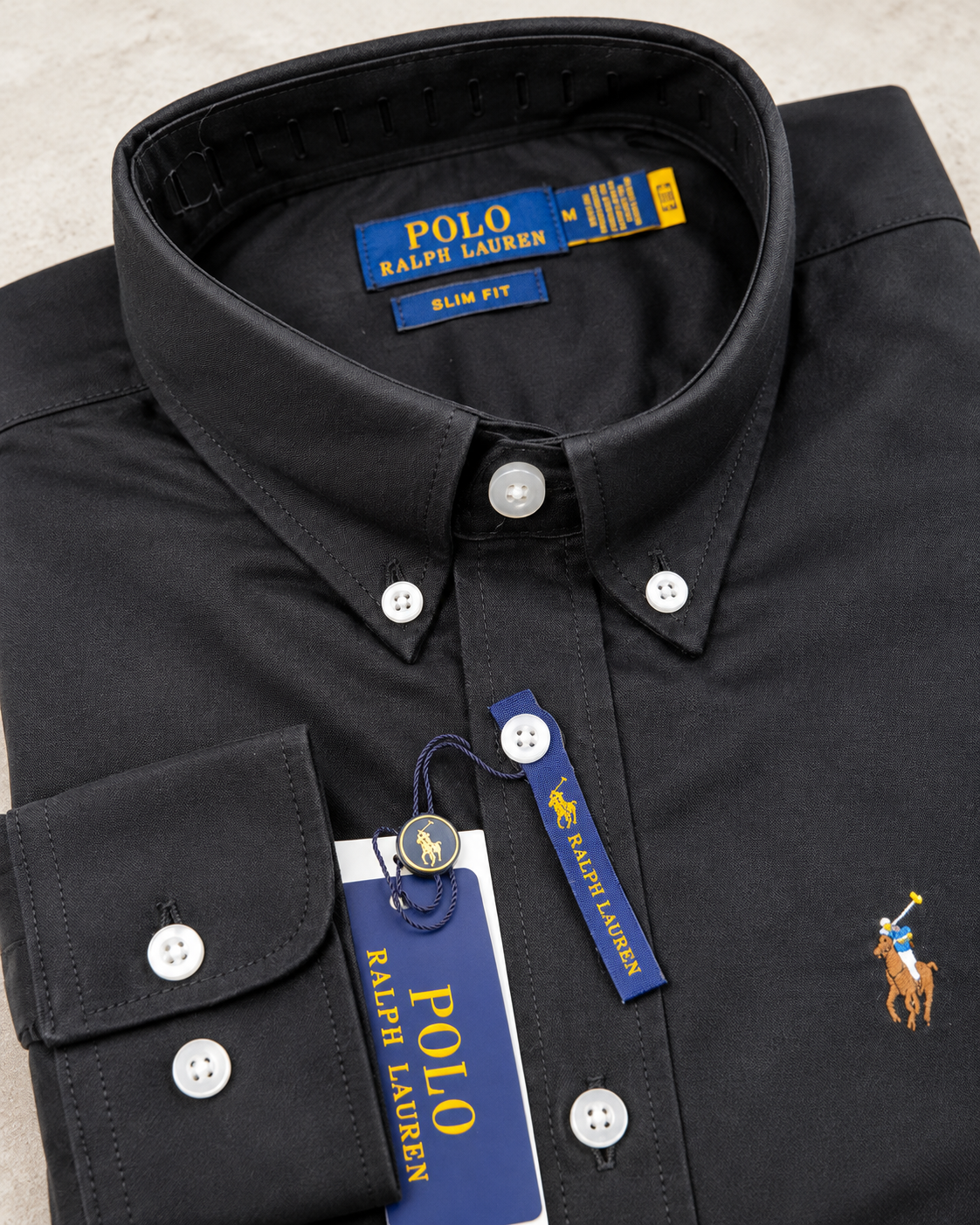 Button-down collar and stitching detail on the black Oxford shirt