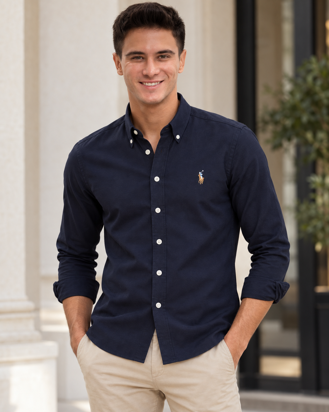 Model wearing the navy slim fit Oxford button-down shirt, lifestyle view