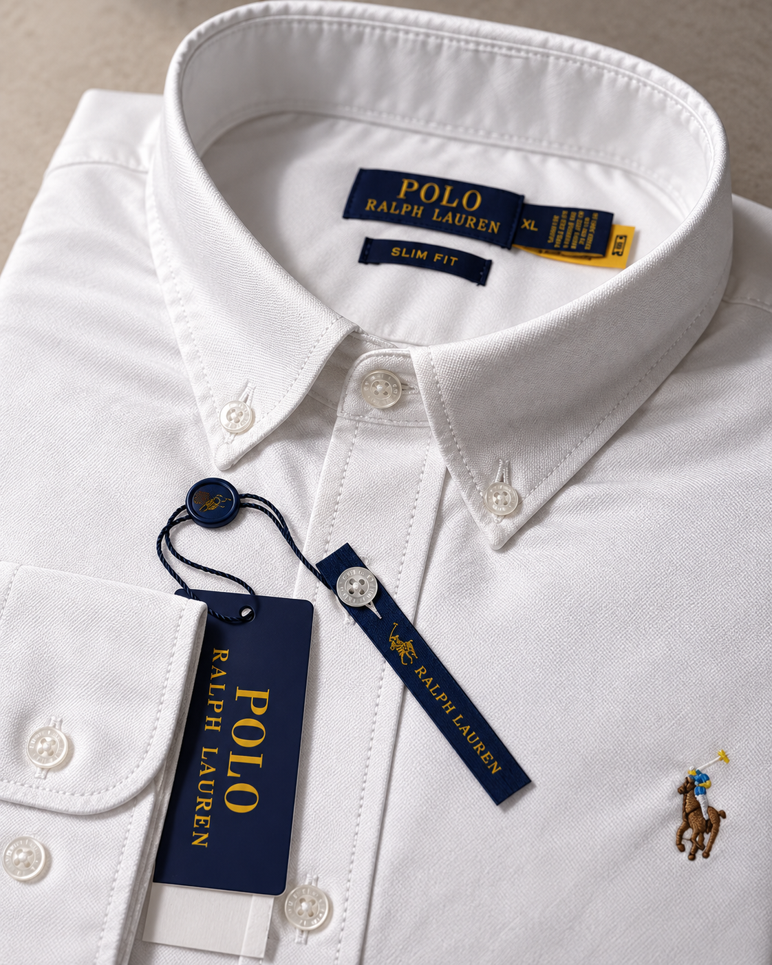 Button-down collar and stitching detail on the white Oxford shirt